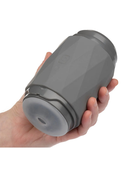 Grijze Vibro Squeeze Stroker van CalExotics in hand met ronde voorkant