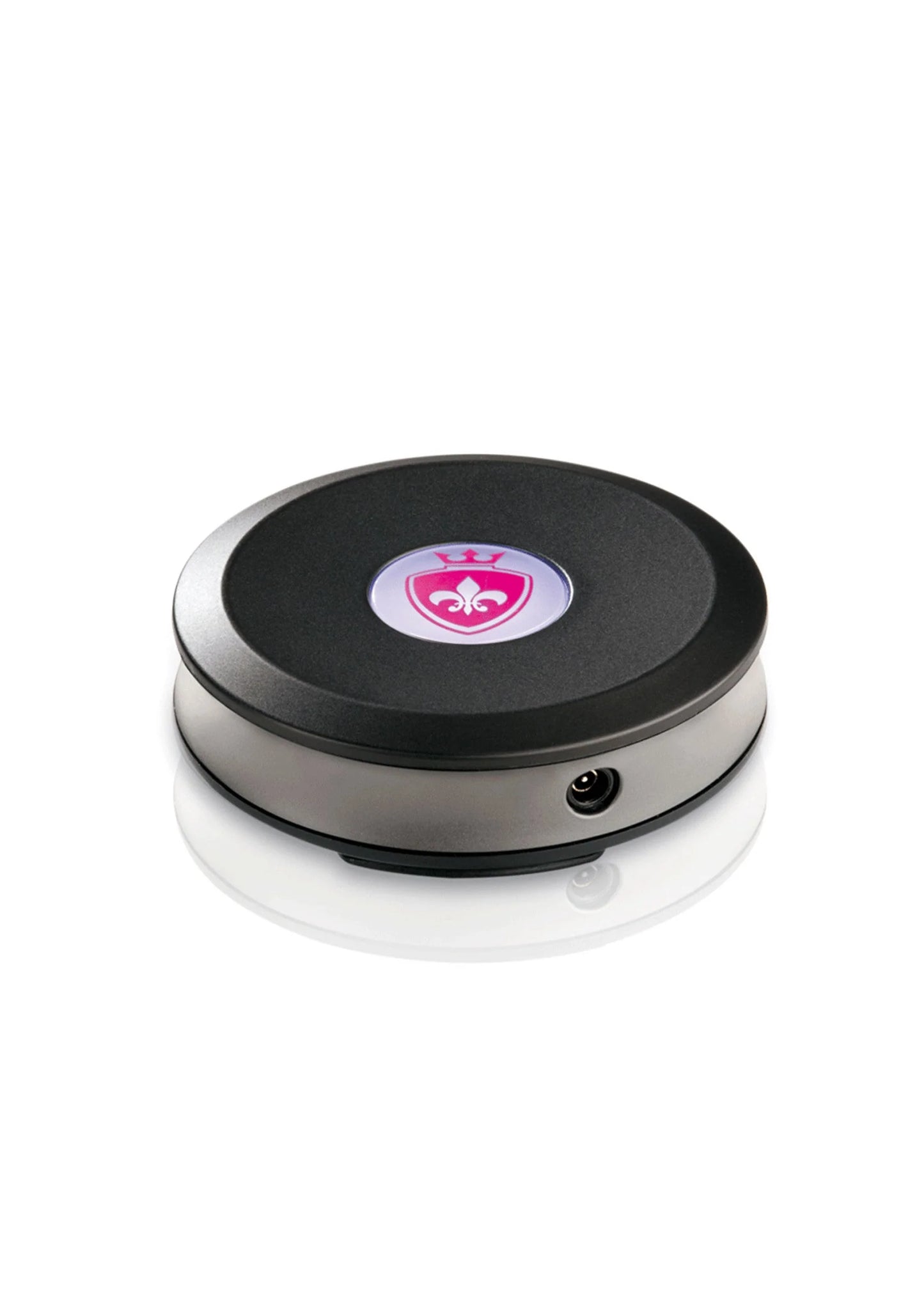 Ronde elektrostimulatie-schijf met roze centraal pictogram, zwart oppervlak en zilveren rand