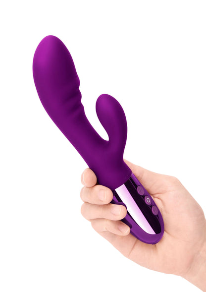 Paarse Le Wand Blend duo-vibrator in hand, met knoppen op de glanzende basis
