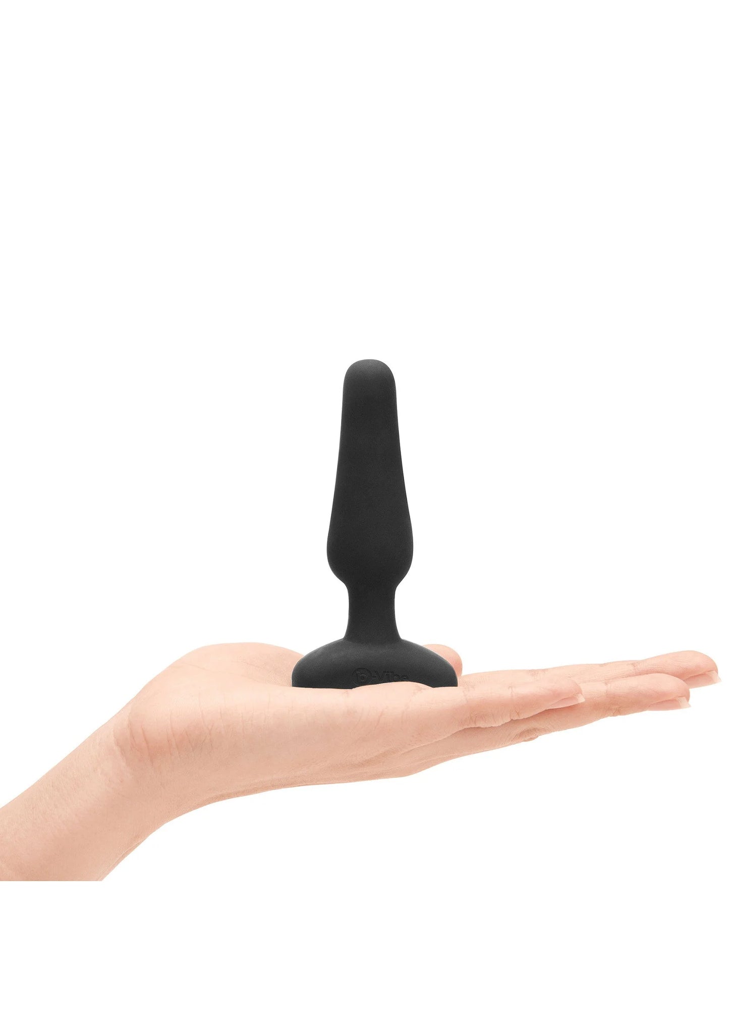 Zwarte anale plug in hand, taps toelopende vorm met brede voet.