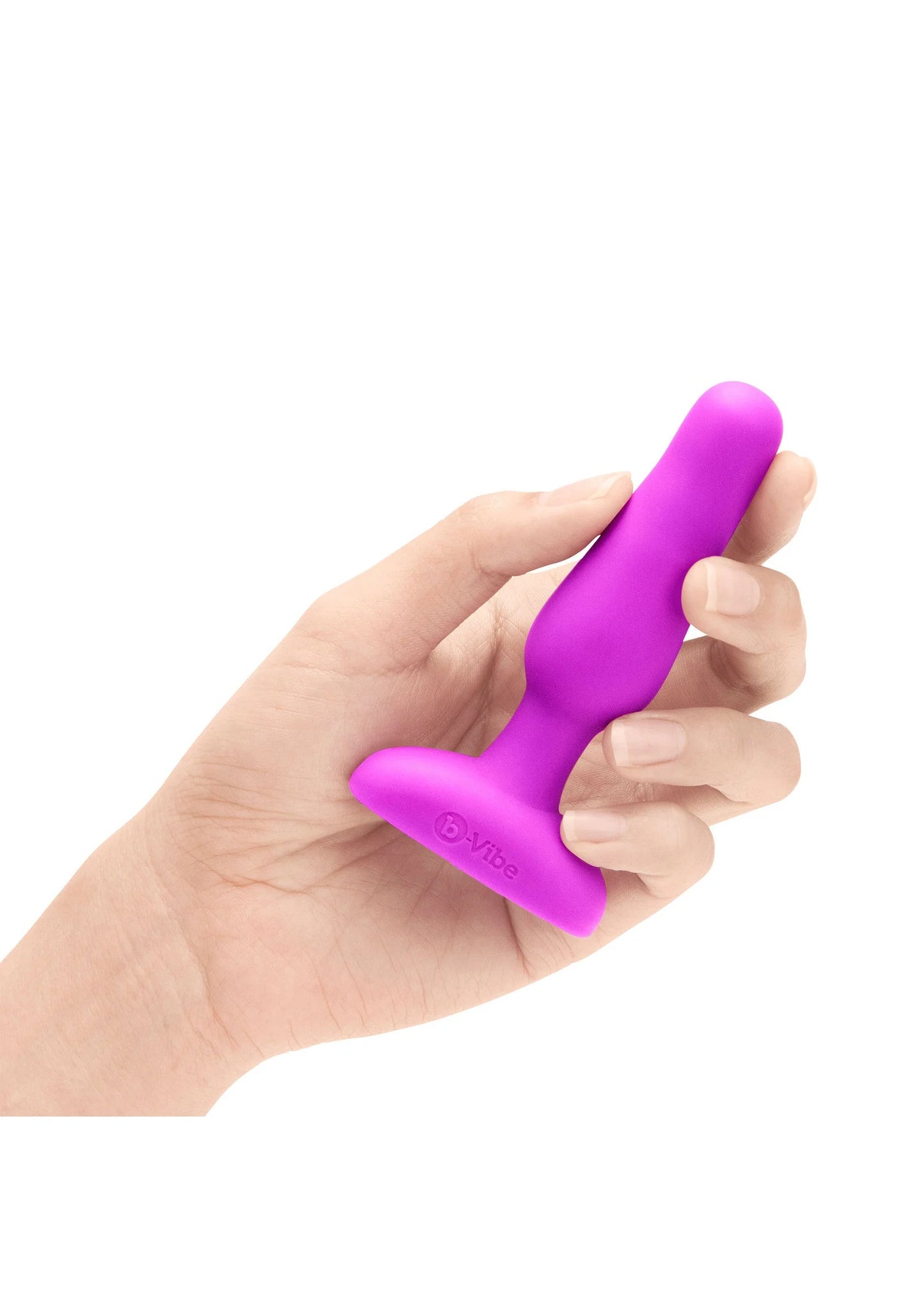 B-Vibe novice plug in fuchsia, hand die de steel vastpakt