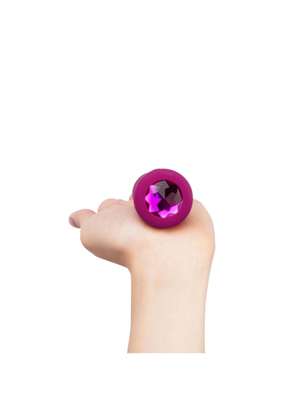 B-Vibe vibrerende jewel plug S/M paars met glinsterend kristal in hand