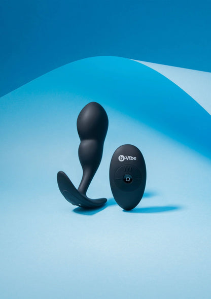 Zwarte P-spot plug met afstandsbediening op set