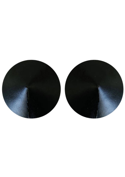 Twee ronde zwarte PU-lederen tepelcovers, close-up van leernerf