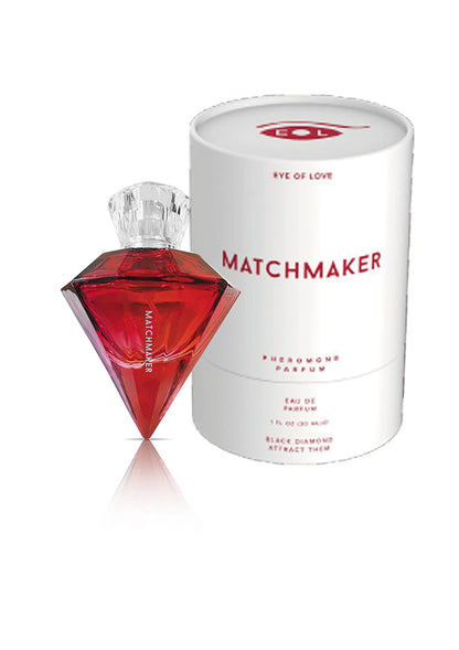 Rode diamantvormige parfumfles met dop naast witte parfumcilinder, 30 ml