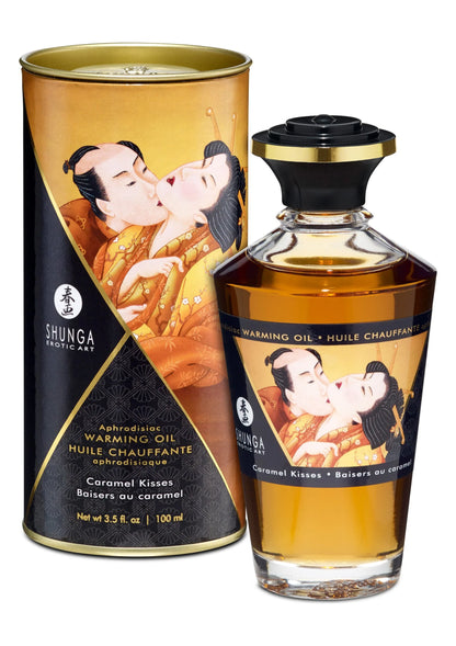Verwarmende olie 100 ml van Shunga: goudbruin blik en fles met caramel kisses