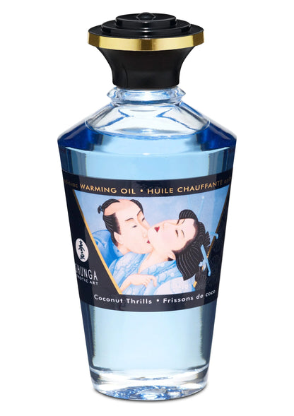 Verwarmende massageolie van Shunga in transparant blauwe fles met zwarte schroefdop.