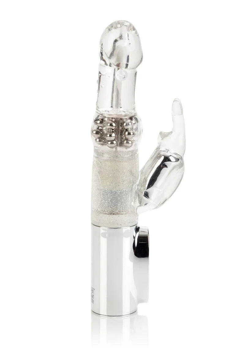 Clear Jack Rabbit vibrator with rotating beads and clitoral stimulator on white background.