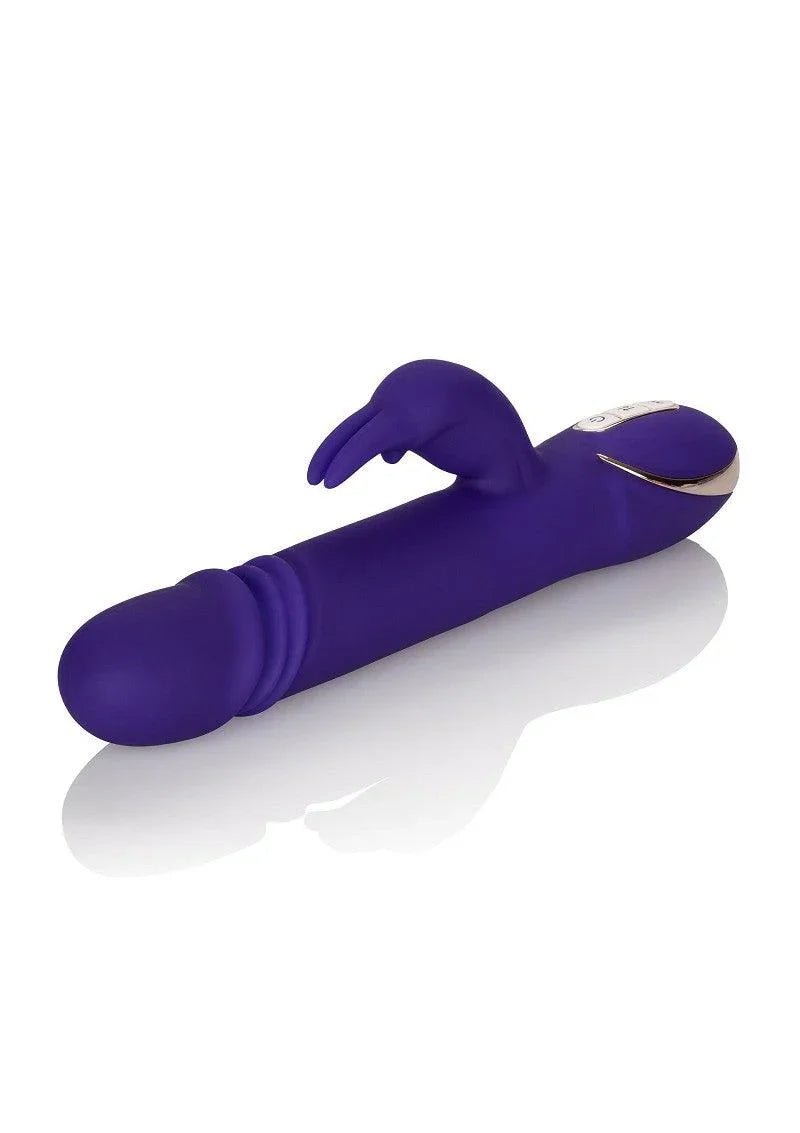 Purple silicone Jack Rabbit vibrator with thrusting feature and rabbit ear stimulator on white background
