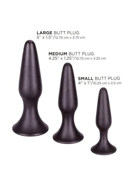 Three black silicone butt plugs in large, medium, and small sizes with measurements in inches and cm
