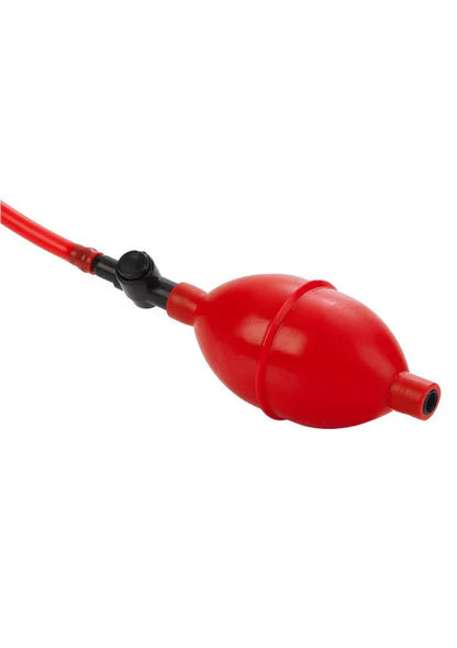 Red inflatable hand pump bulb with attached tubing and valve on white background