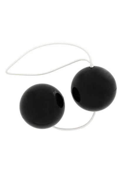 Black kegel balls connected by a white flexible silicone string for pelvic exercise and pleasure