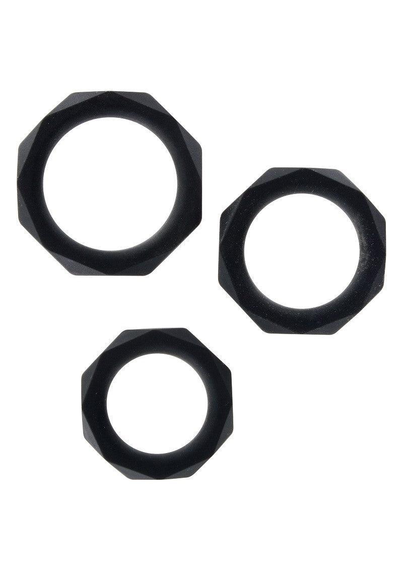 Three black faceted silicone power rings of different sizes on white background